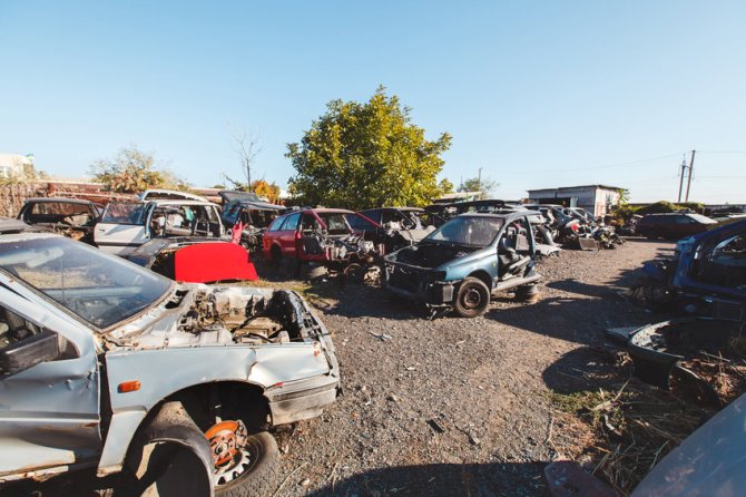 Scrap car recycle yard. Hundreds of old cars at a scrap yard